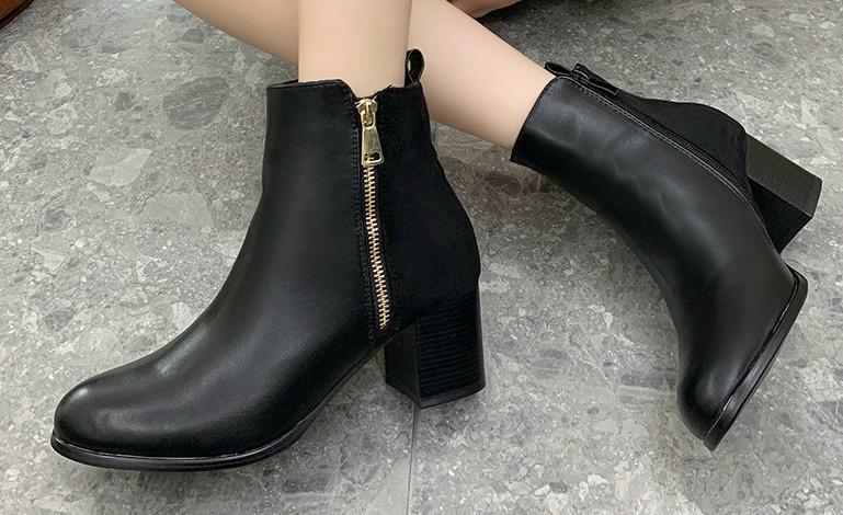 Bottines noires à zip doré et talon moyen