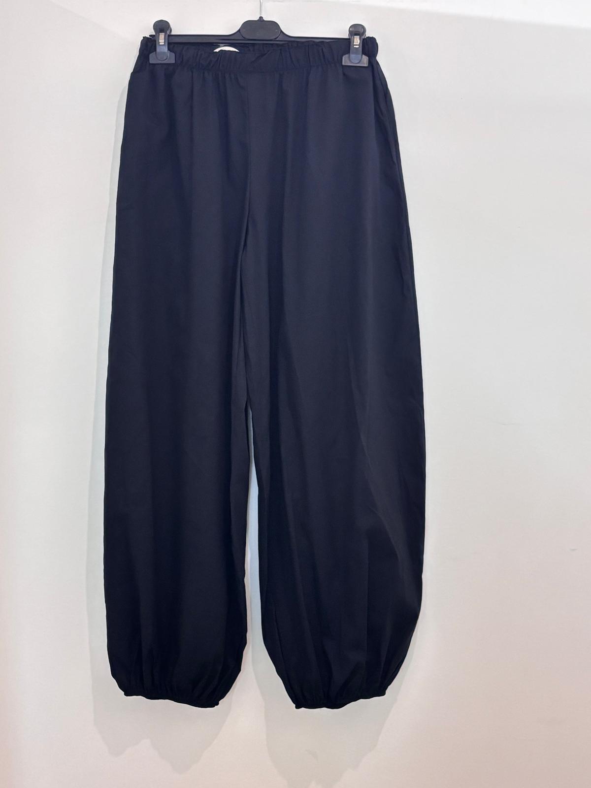 Pantalon large taille élastiquée style bouffant resserré aux chevilles