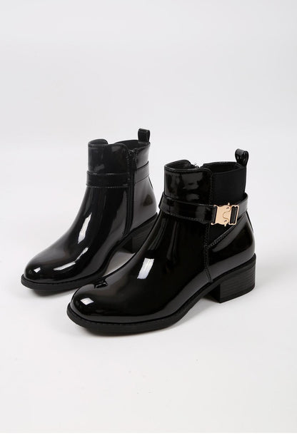 Bottines à boucle dorée et talon bas