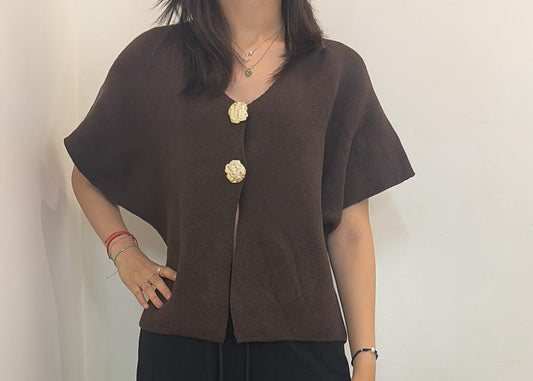 Gilet sans manches à boutons dorés