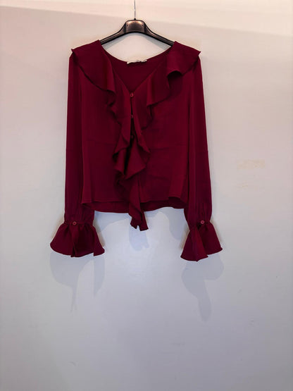 Blouse élégante à volants et manches évasées