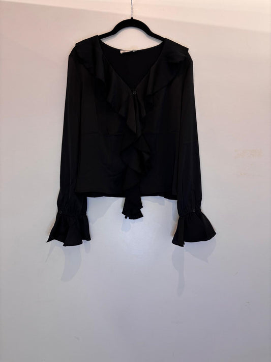 Blouse élégante à volants et manches évasées