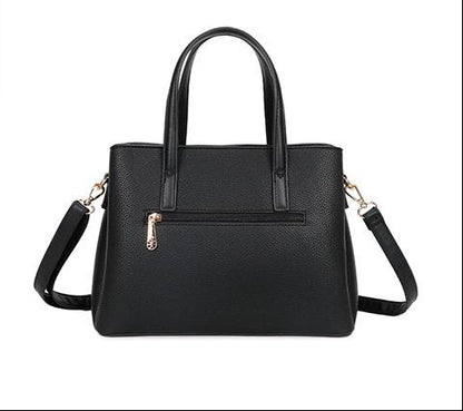 Sac noir à doubles anses avec finitions dorées