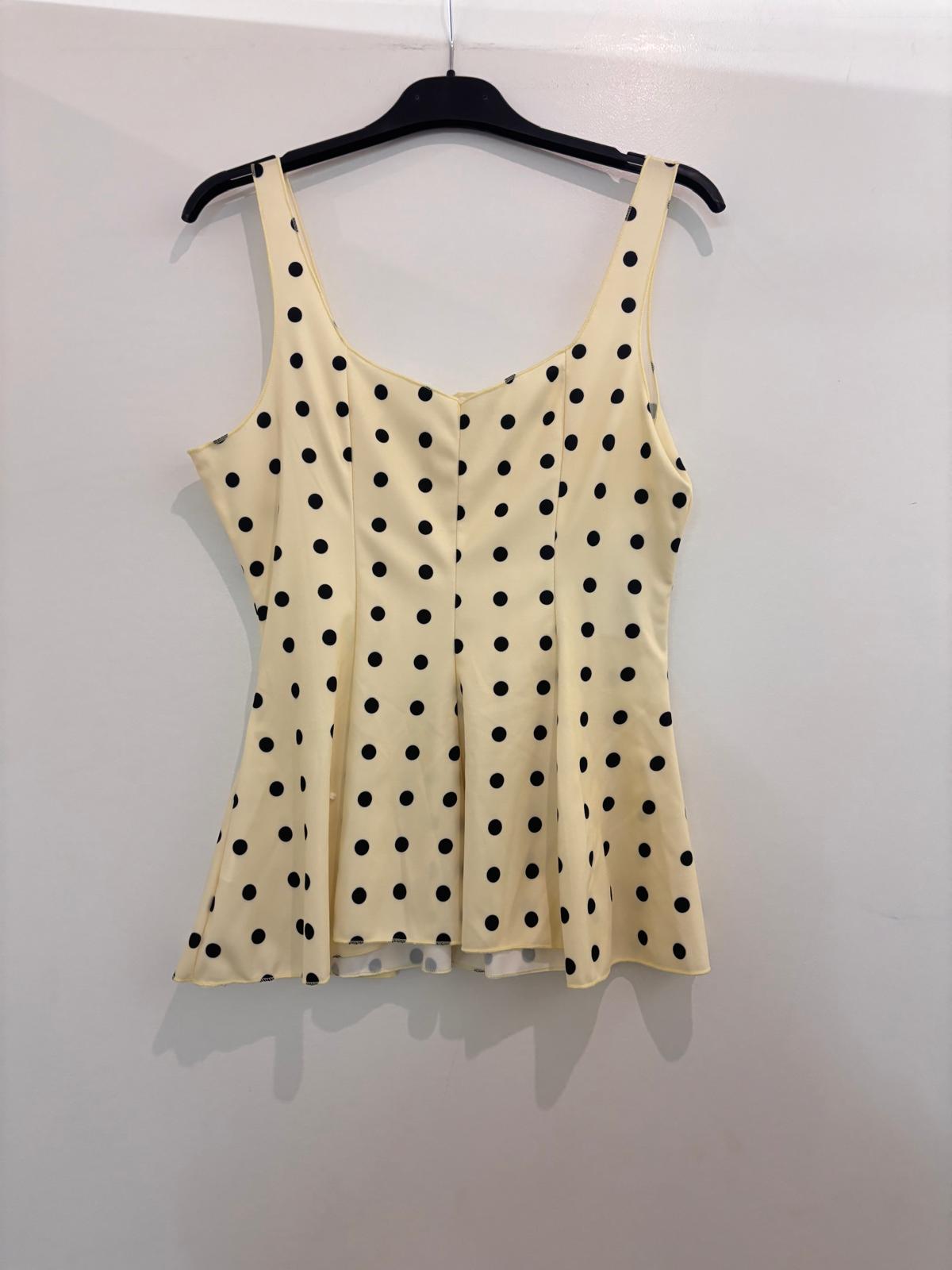 Top à bretelles à pois avec décolleté cœur et bas évasé peplum