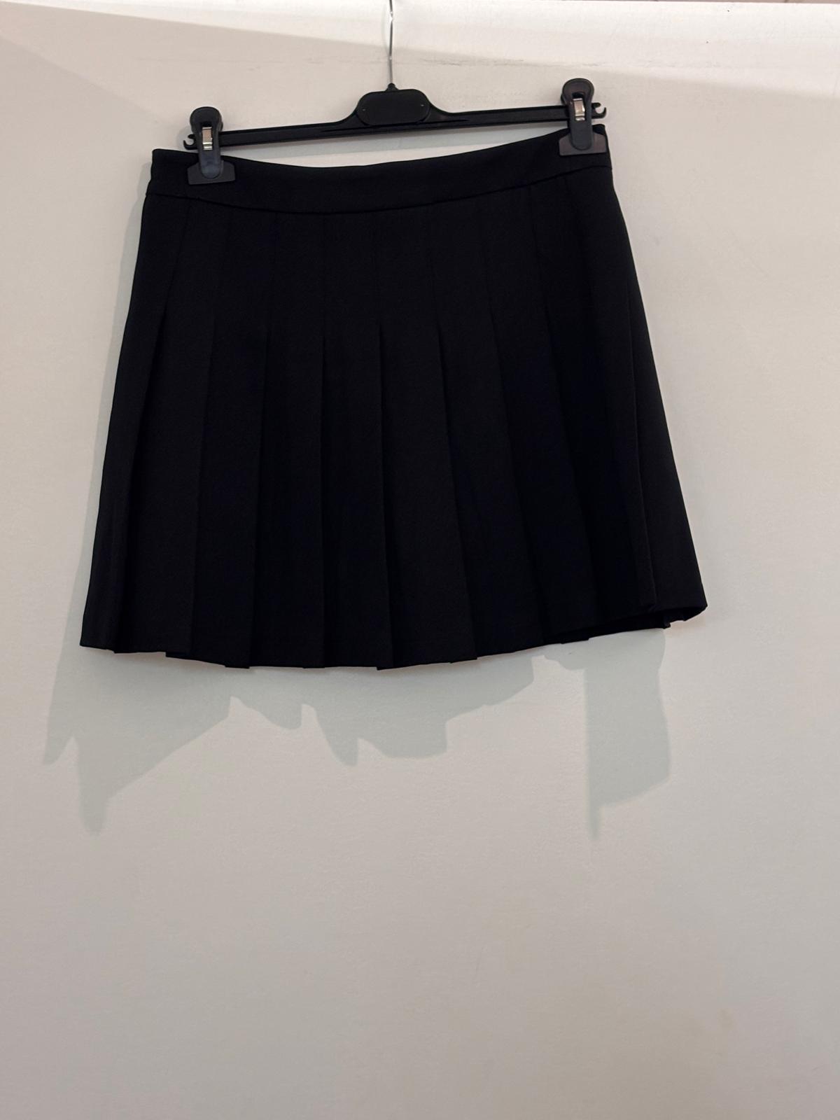 Jupe avec short intégré à plis style tennis avec taille haute et fermeture éclair