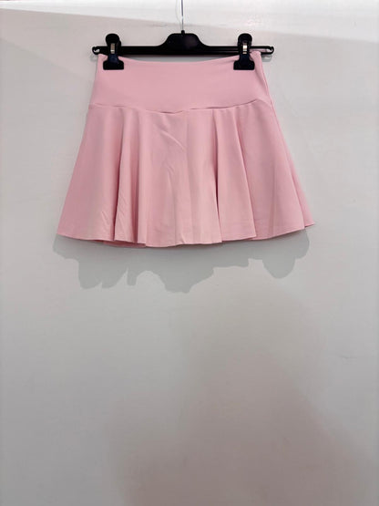 Mini-jupe avec short et poche à larges plis plats