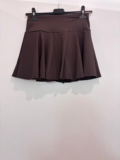 Mini-jupe avec short et poche à larges plis plats