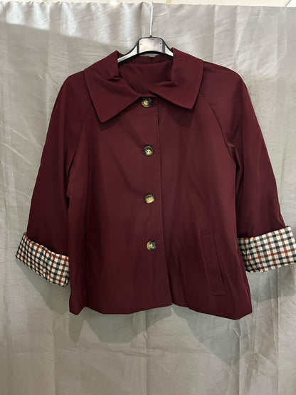 Veste avec col élégant et manches à carreaux